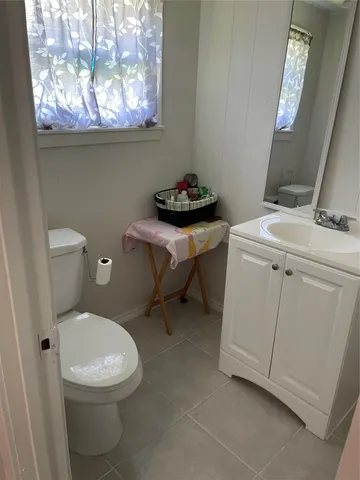 a bathroom with a toilet and a sink