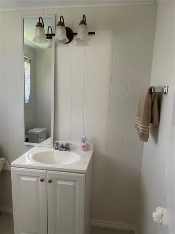 a bathroom with a sink and mirror