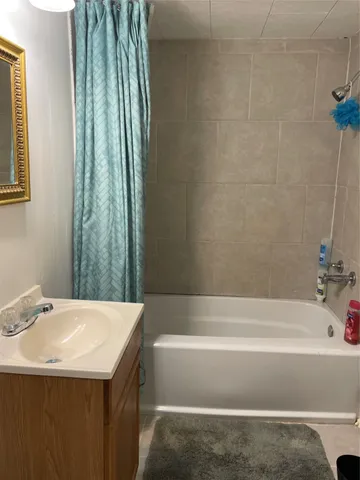 a bathroom with a sink and a bathtub