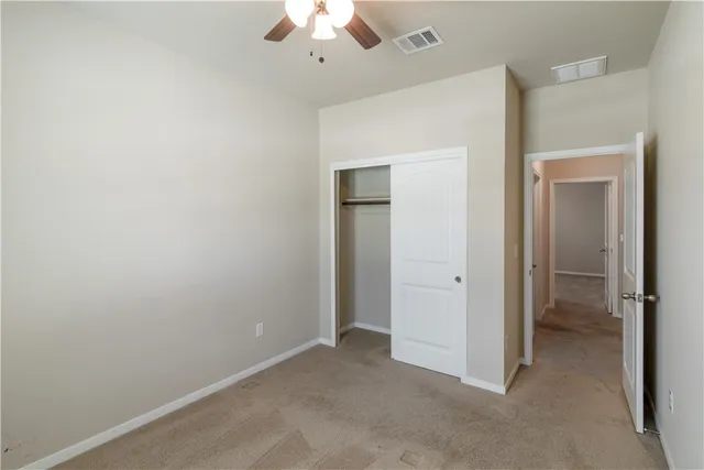 an empty room with a bathroom