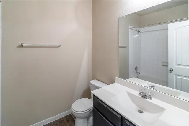 a bathroom with a sink toilet and vanity