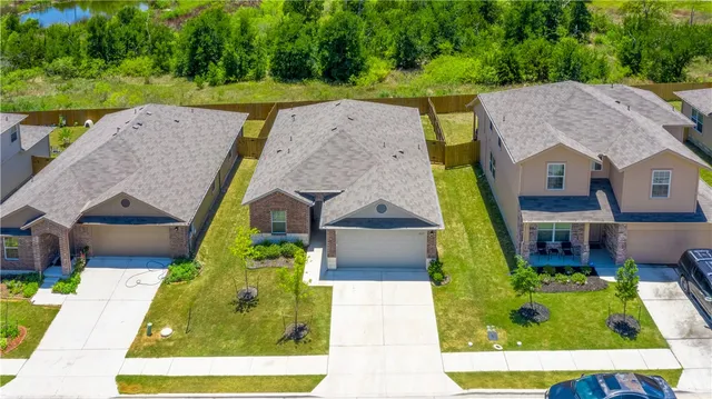 an aerial view of a house with a garden