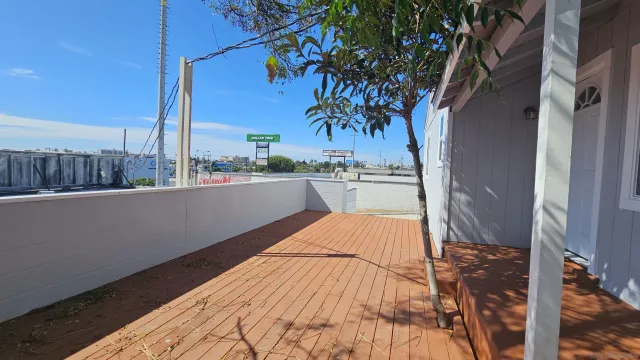 a view of a house with a backyard