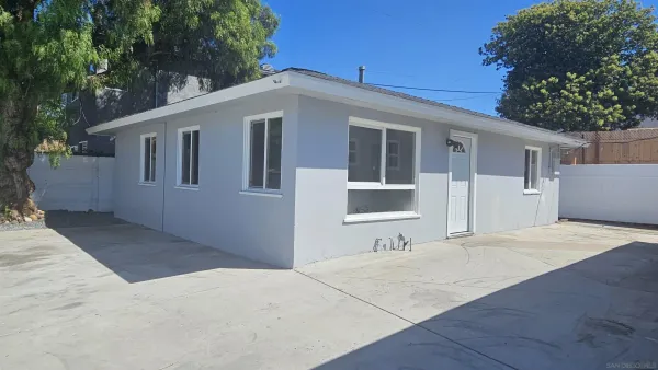 a front view of a house with yard