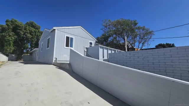 a view of a house with a small yard
