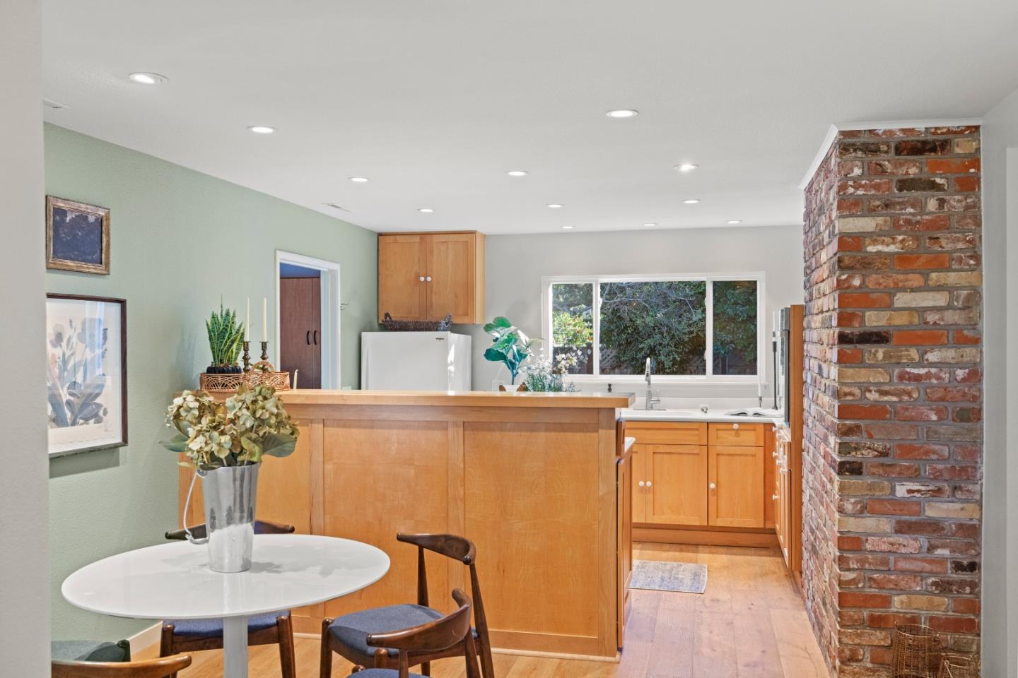 26571 Aspen Place Carmel, CA 93923 - Photo 13 of 46 a dining room with furniture a chandelier and window