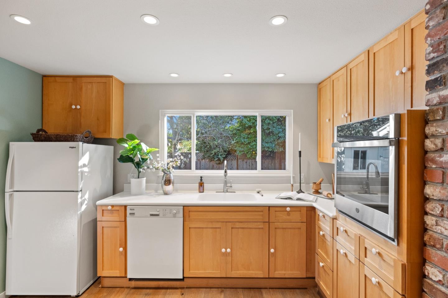 26571 Aspen Place Carmel, CA 93923 - Photo 14 of 46 a kitchen with sink a refrigerator and outdoor view