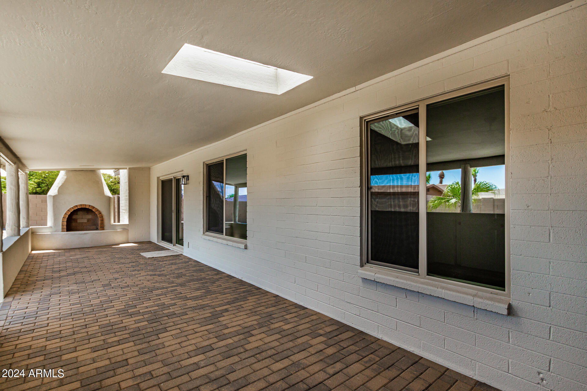 4109 West Hatcher Road Phoenix, AZ 85051 - Photo 29 of 33 a view of livingroom with window and fireplace
