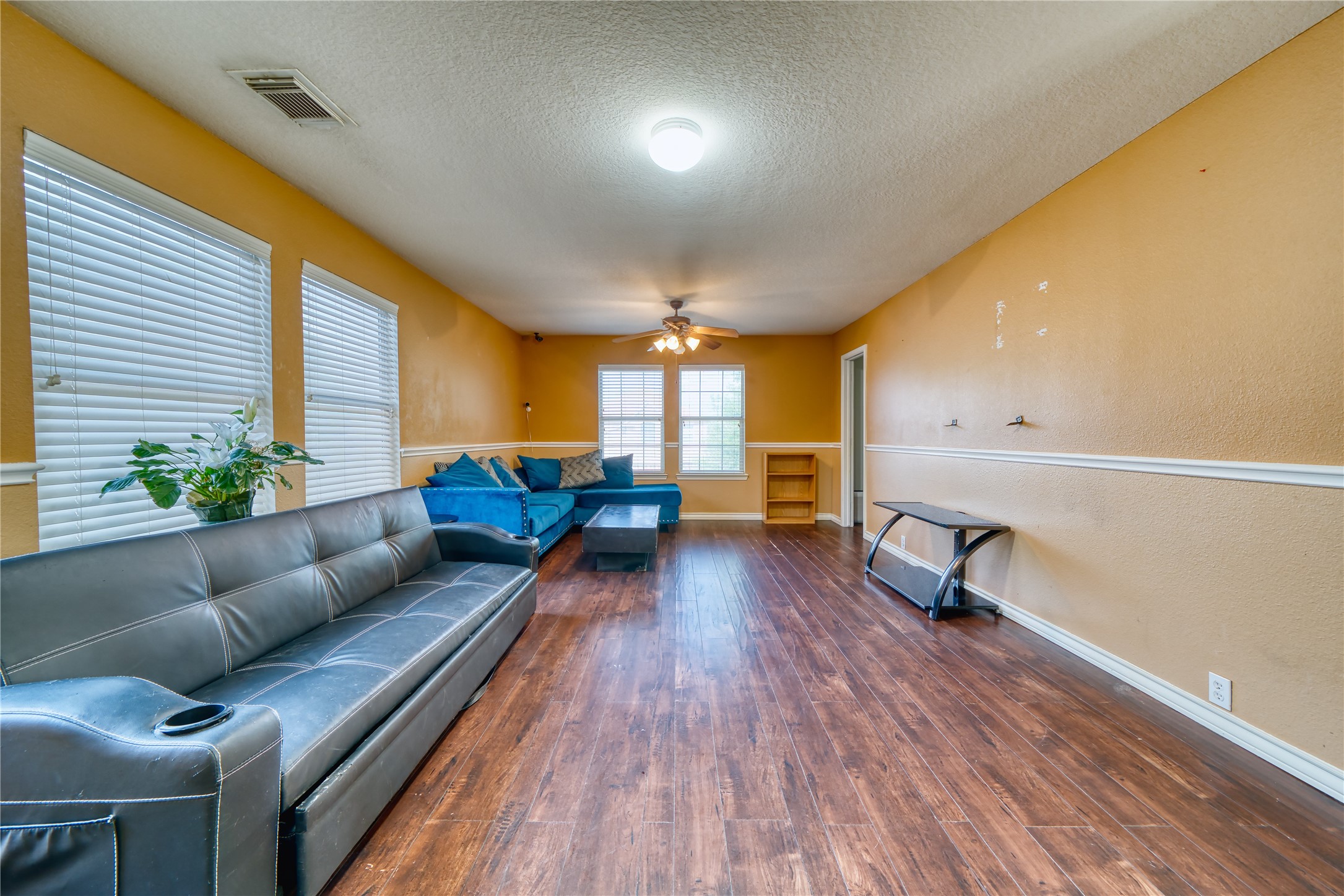 2210 Mountain Ranch Drive Houston, TX 77049 - Photo 24 of 36 a living room with furniture and a wooden floor