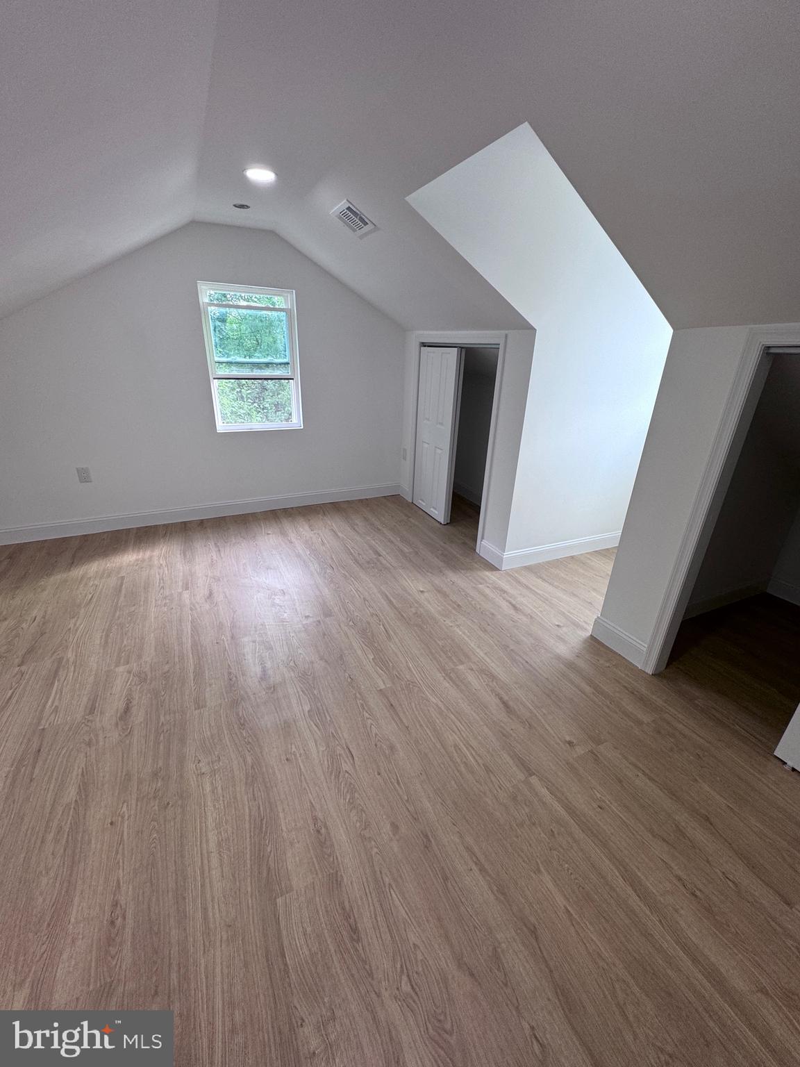 4667 Hawthorne Street Philadelphia, PA 19124 - Photo 14 of 21 a view of an empty room with wooden floor and a window