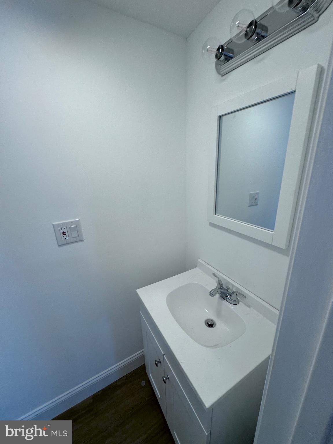 4667 Hawthorne Street Philadelphia, PA 19124 - Photo 17 of 21 a bathroom with a sink and mirror