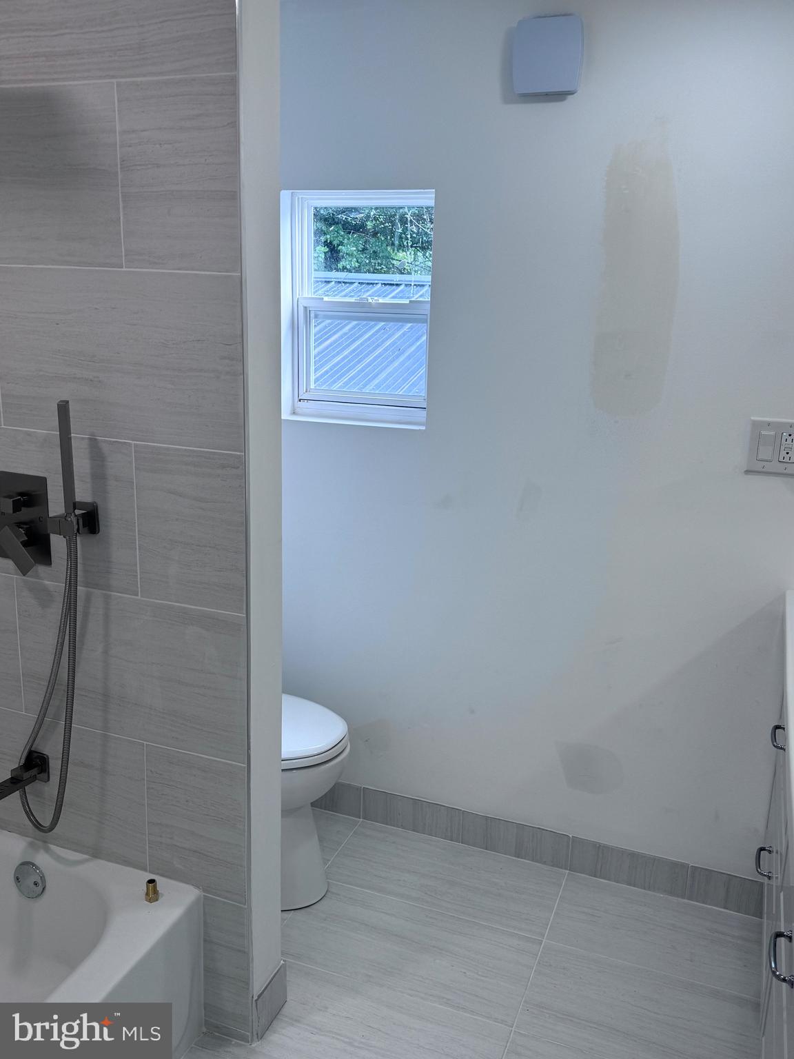 4667 Hawthorne Street Philadelphia, PA 19124 - Photo 8 of 21 a bathroom with a sink toilet and a shower