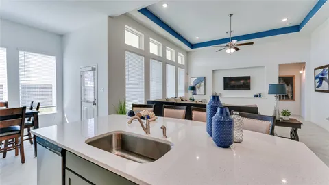 a kitchen with sink cabinets and window