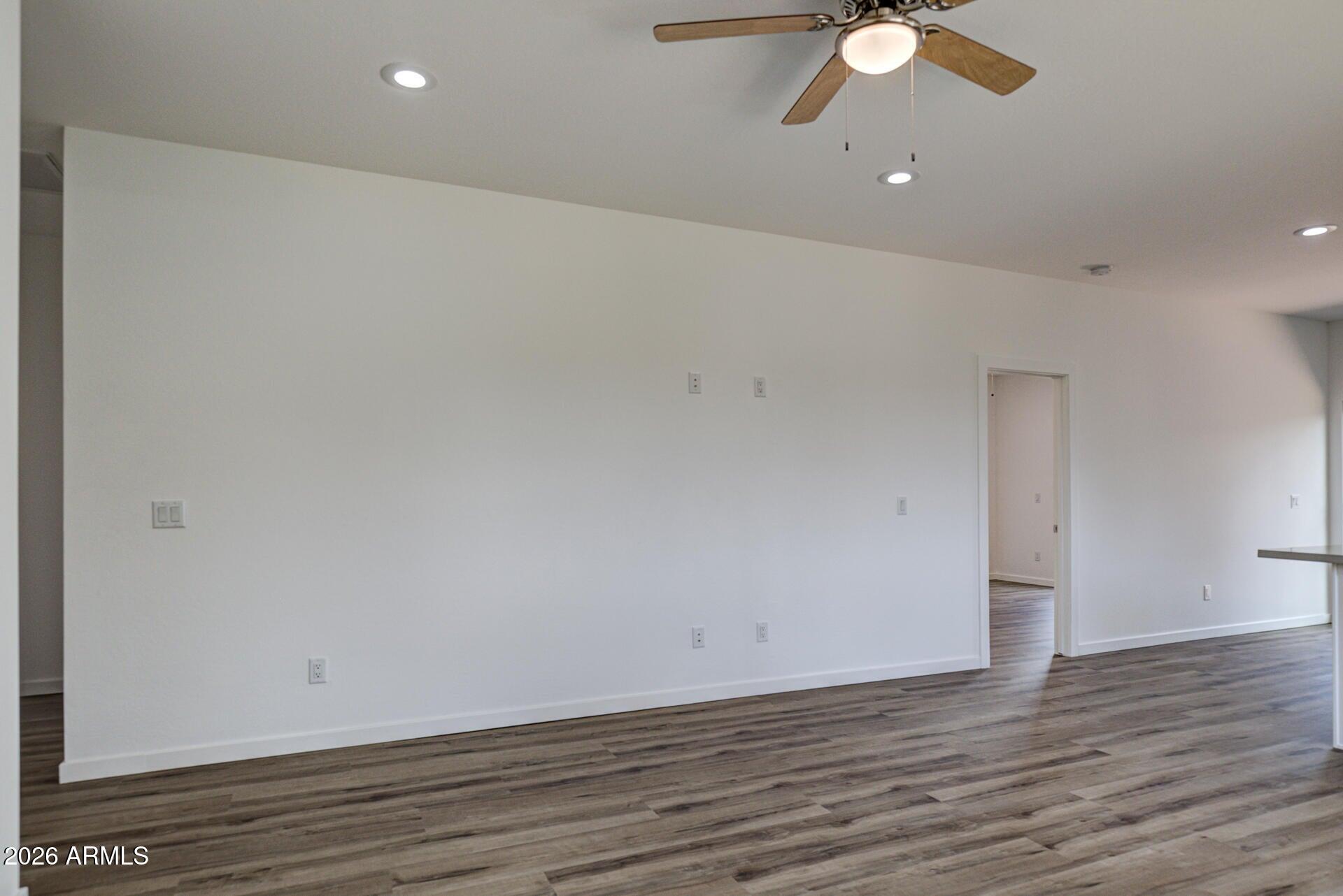 2002 East Thunder Mountain Payson, AZ 85541 - Photo 13 of 34 an empty room with wooden floor and fan