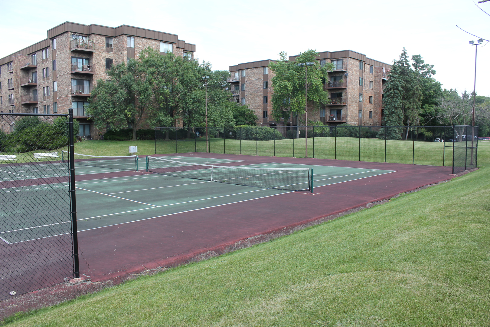 420 Walnut Creek Road, Unit 3105 Lisle, IL 60532 - Photo 14 of 15 a view of a tennis court