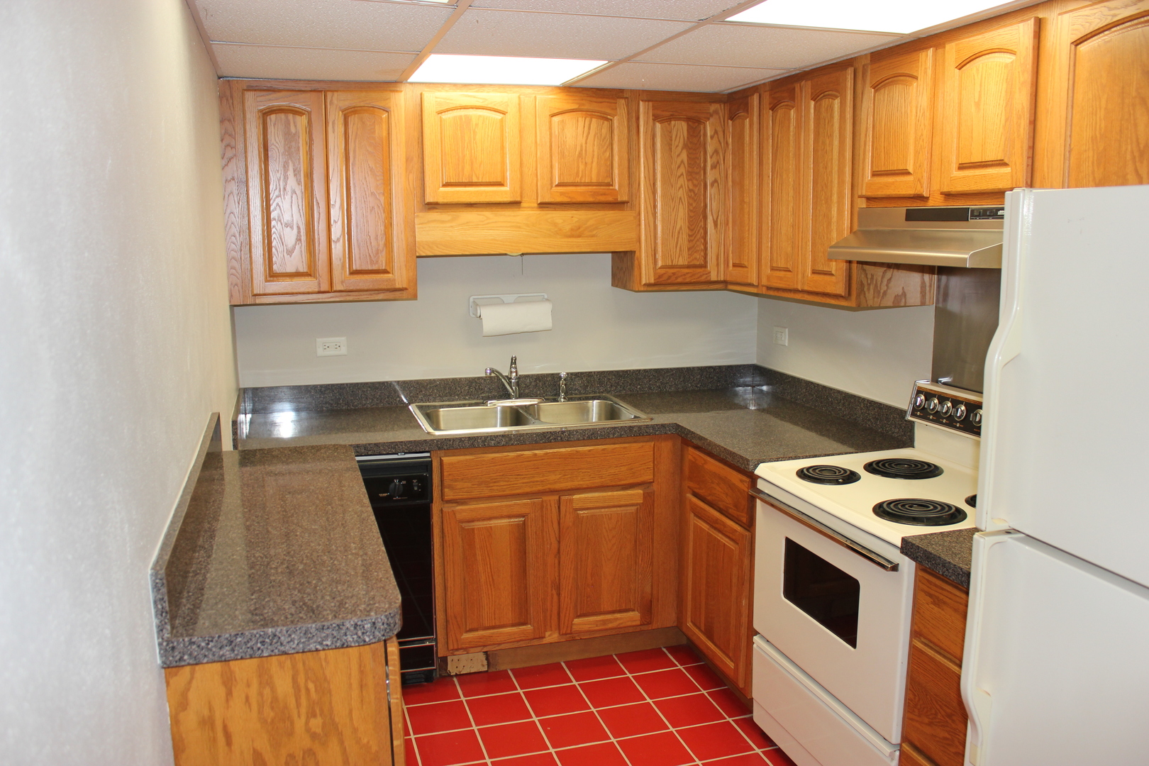 420 Walnut Creek Road, Unit 3105 Lisle, IL 60532 - Photo 5 of 15 a kitchen with stainless steel appliances a stove a sink and a microwave