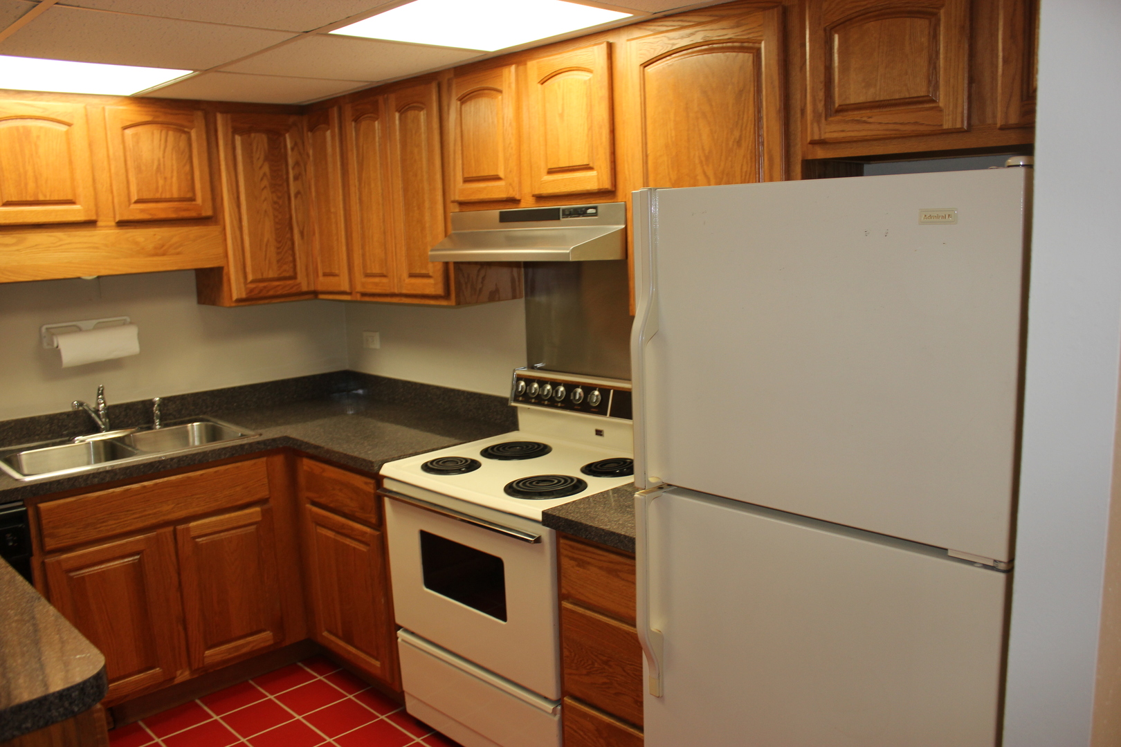 420 Walnut Creek Road, Unit 3105 Lisle, IL 60532 - Photo 6 of 15 a kitchen with stainless steel appliances granite countertop a refrigerator sink and cabinets