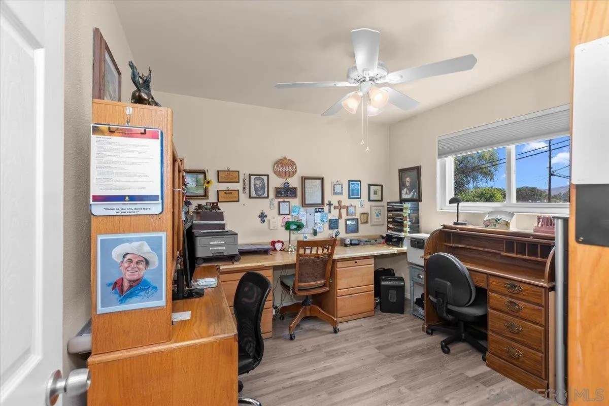 9254 Shadow Hill Road Santee, CA 92071 - Photo 23 of 34 a room with furniture a rug and a window