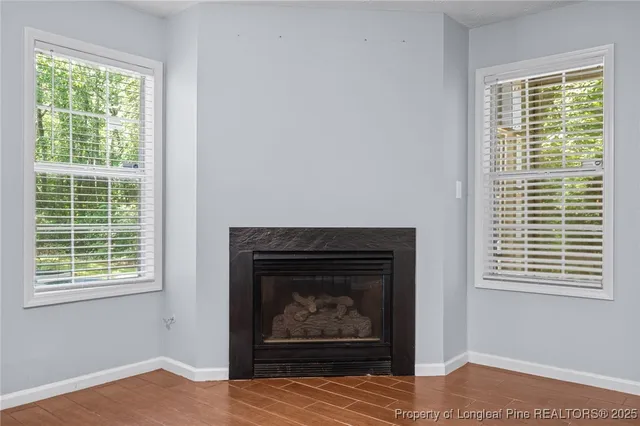 a view of a livingroom with furniture and chandelier fan