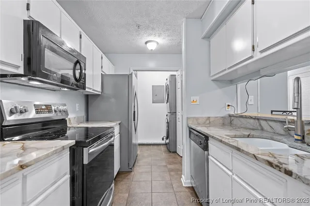a kitchen with a refrigerator stove and microwave