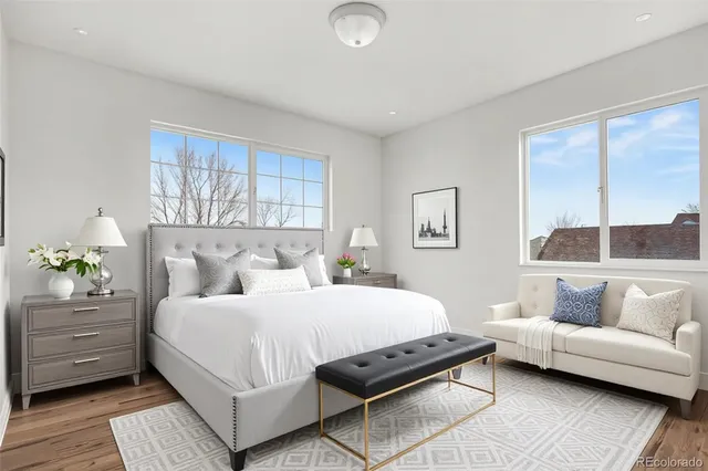 a bedroom with a bed and a couch