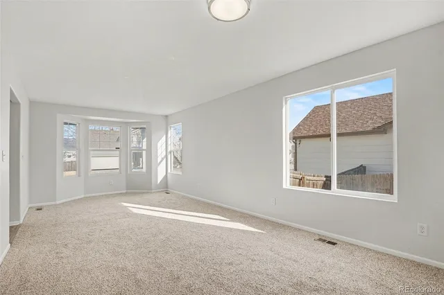a view of an empty room with a window