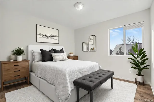 a bedroom with a bed and a couch