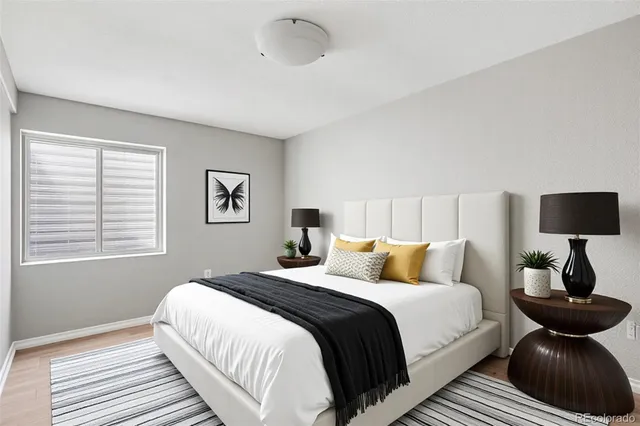 a bedroom with bed and a window