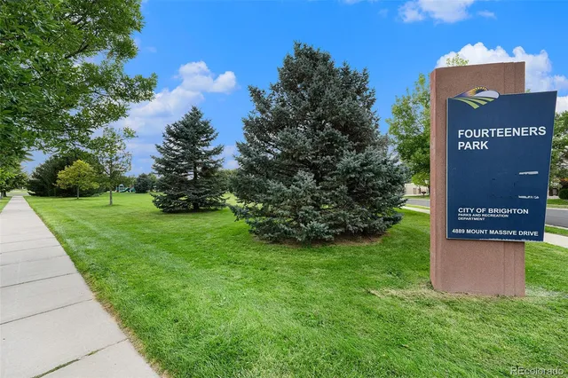 a view of a street with benches in the background