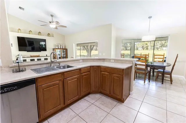 a view of a dining room with furniture and a window