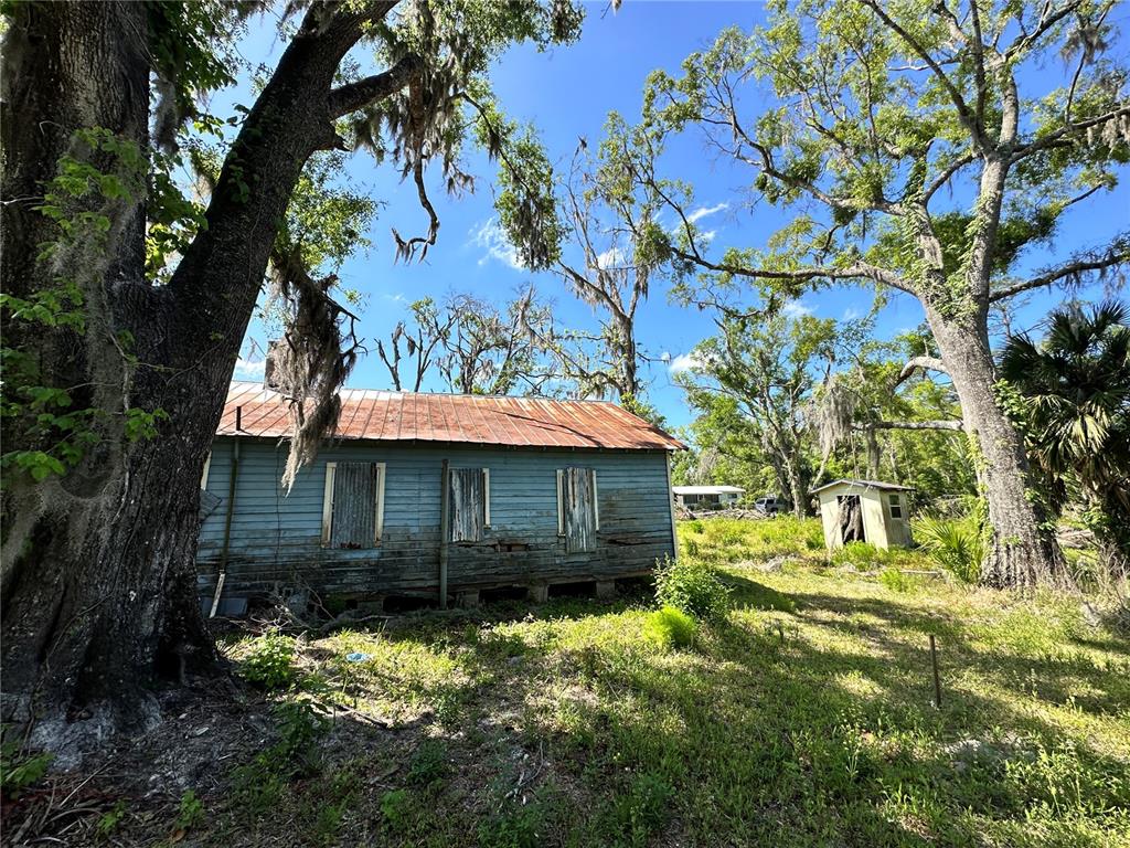 823 South Warner Avenue Perry, FL 32348 - Photo 25 of 30 a front view of a house with a yard