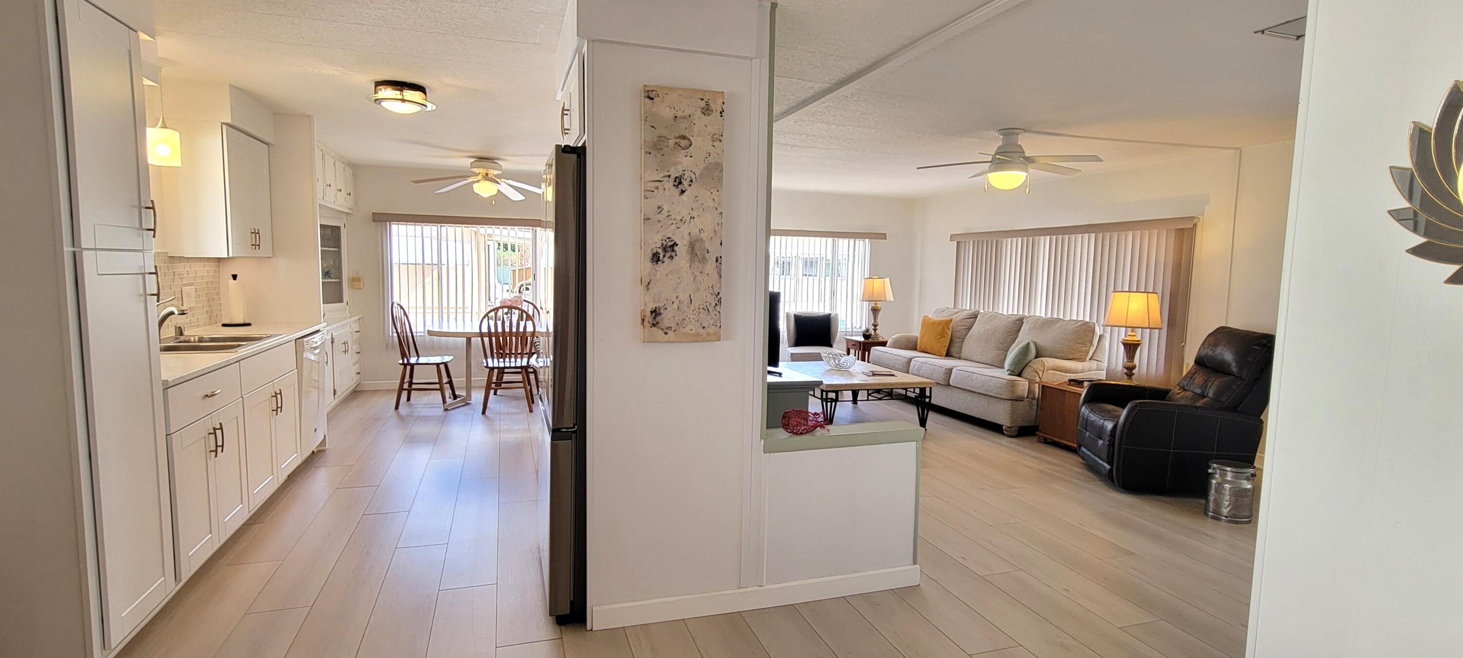 244 Standing Bear Cathedral City, CA 92234 - Photo 14 of 76 KITCHEN AND LIVING ROOM AREA