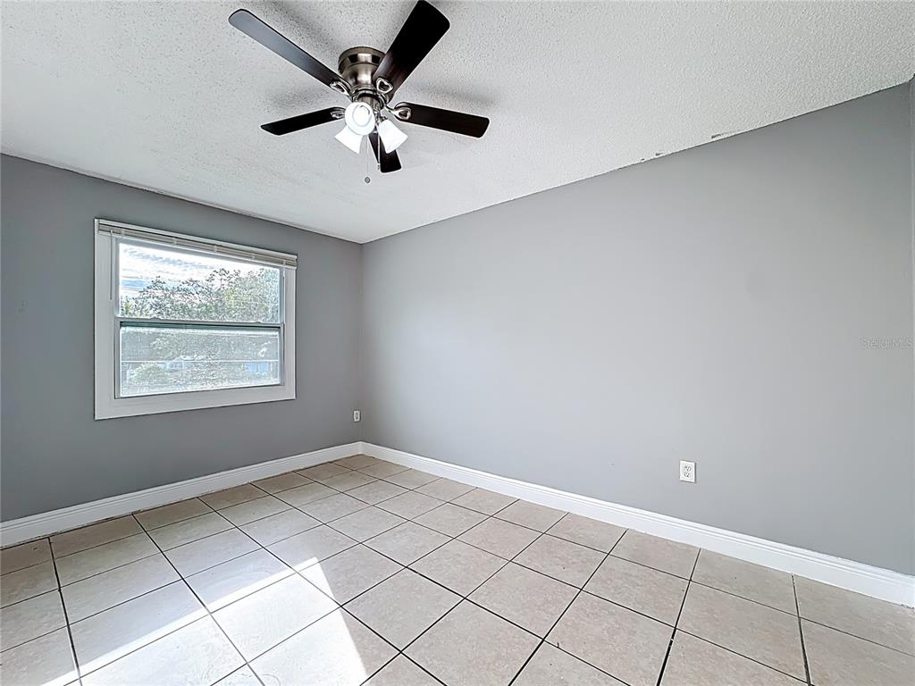 2753 L B McLeod Road, Unit D Orlando, FL 32805 - Photo 19 of 48 a view of an empty room with a window