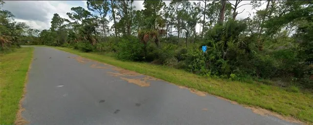 a view of a road with a yard