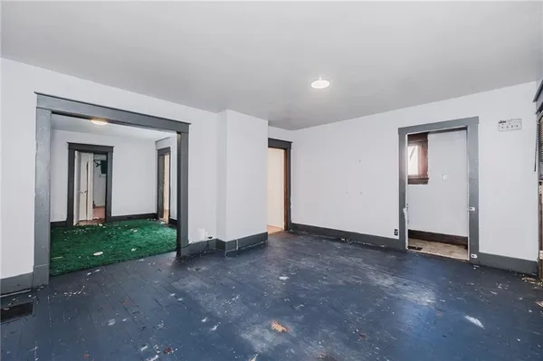 a view of an empty room and closet area