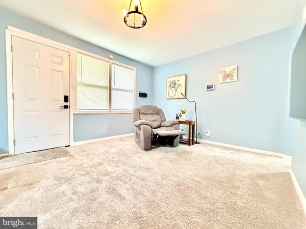 a spacious bedroom with a bed and a large window