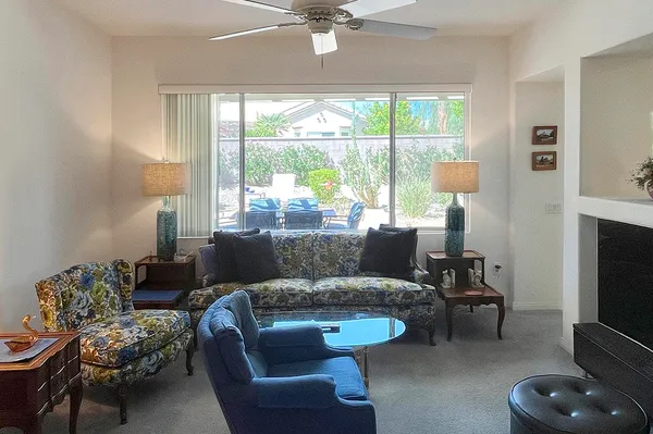 a living room with furniture and a large window
