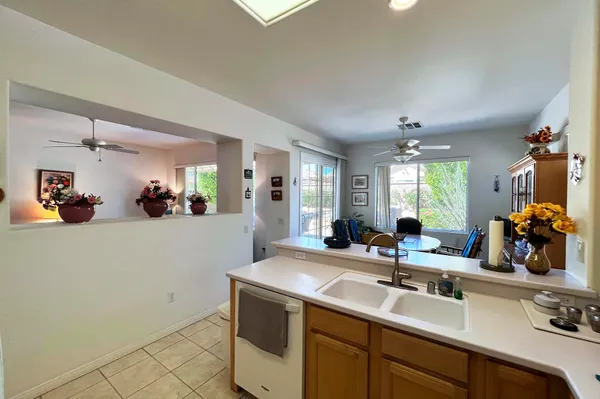a view of a kitchen with a sink and cabinet area