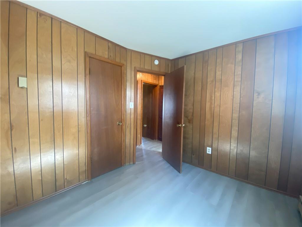 203 Irving Avenue Latrobe, PA 15650 - Photo 11 of 17 a view of an empty room with wooden floor