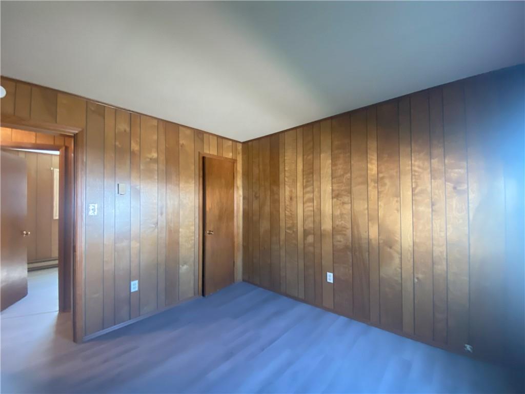 203 Irving Avenue Latrobe, PA 15650 - Photo 15 of 17 a view of an empty room with wooden floor