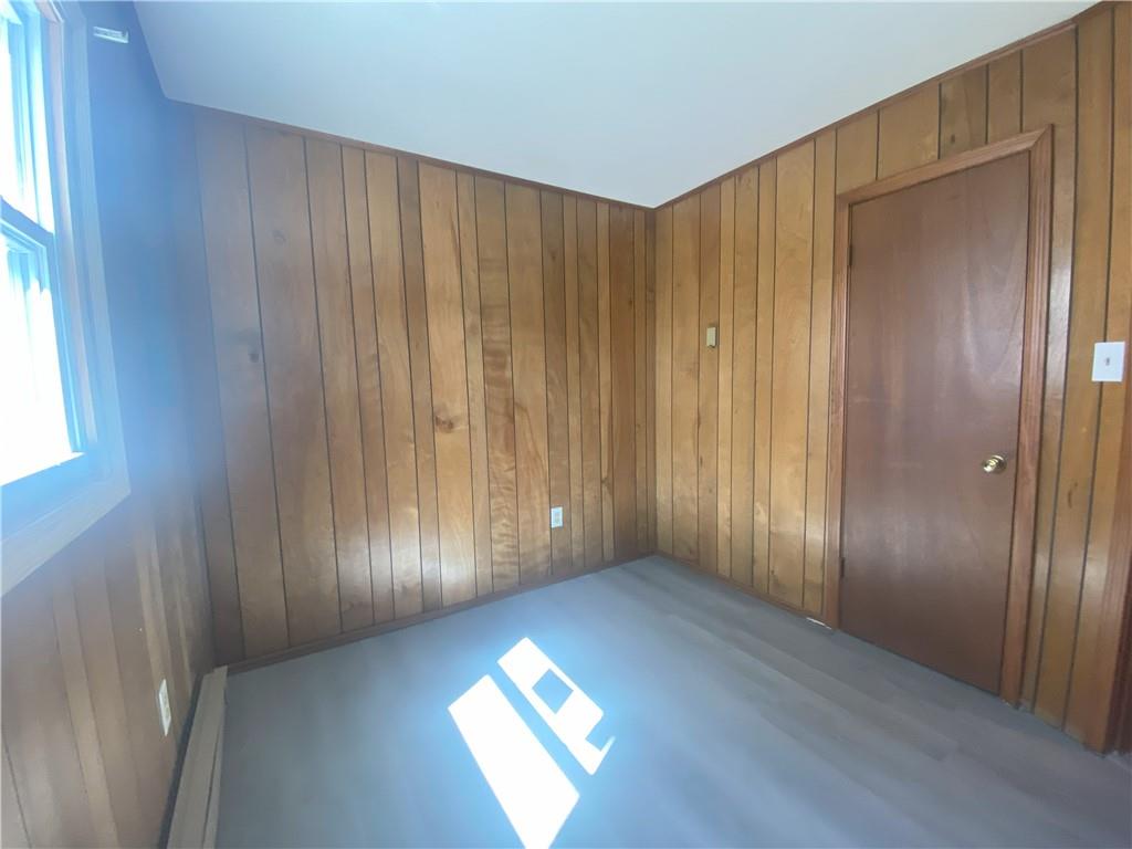 203 Irving Avenue Latrobe, PA 15650 - Photo 10 of 17 a view of an empty room with wooden floor and a window