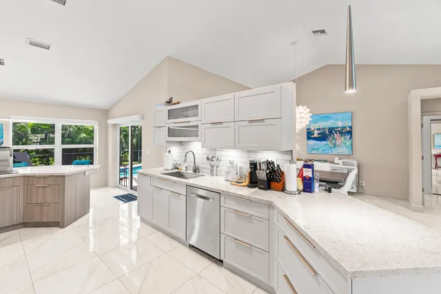 a kitchen with sink cabinets and window