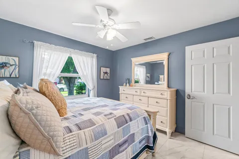 a view of walk in closet with clothes