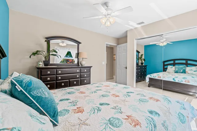 a bedroom with a bed couch and window