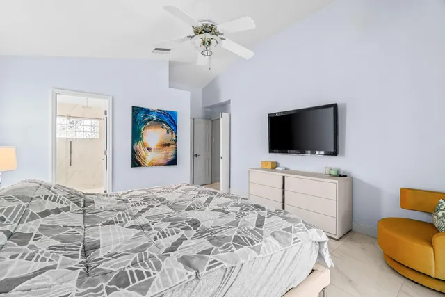 a bathroom with a shower sink and mirror