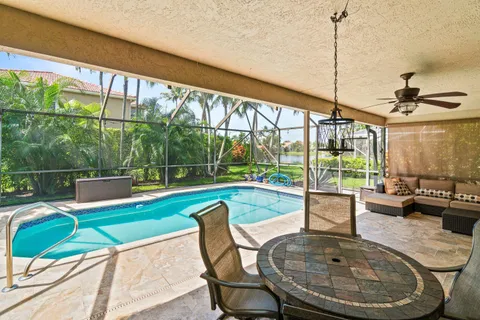 a view of a backyard with a swimming pool