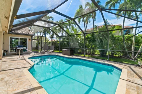 a front view of house with outdoor seating and patio