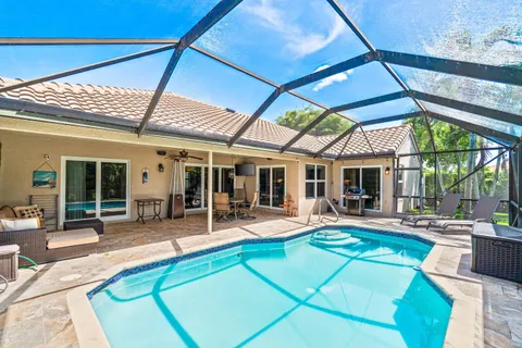 a view of backyard with seating area and furniture