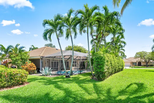 a view of a lake with houses in the back