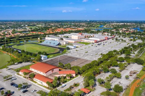 a view of a park with swings and slides